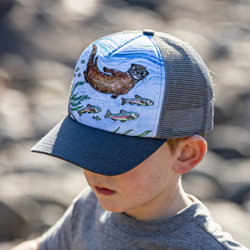 Boy wearing a Sunday Afternoons River Otter Trucker